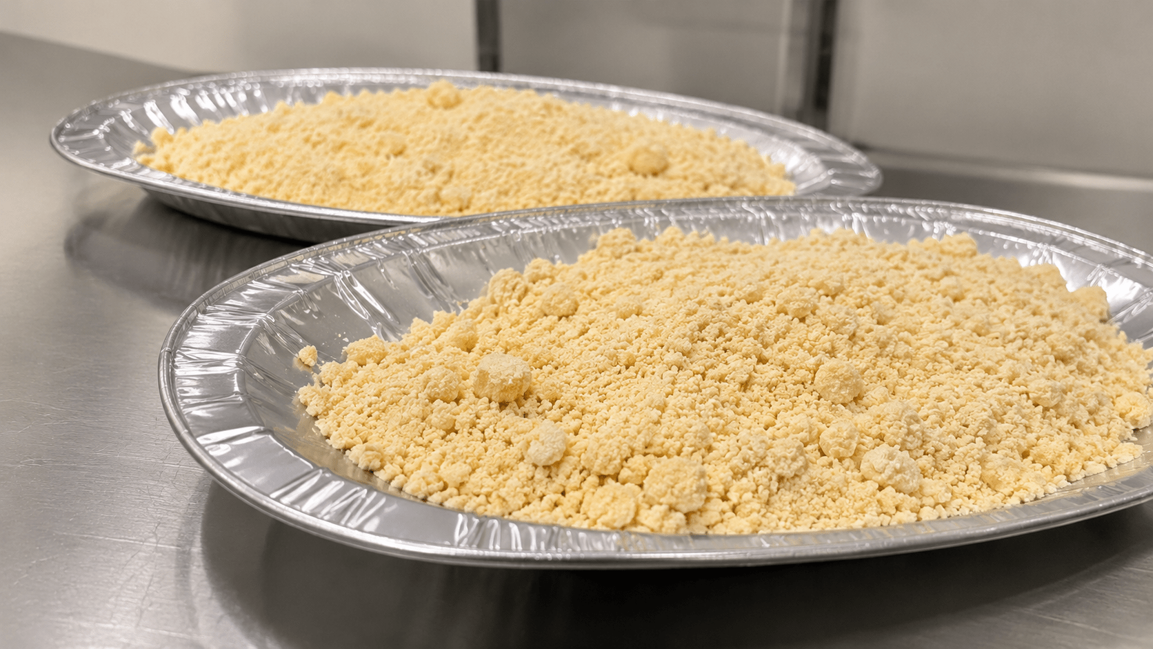 Finished cannabinoid infusion powder on production trays ready for flower application